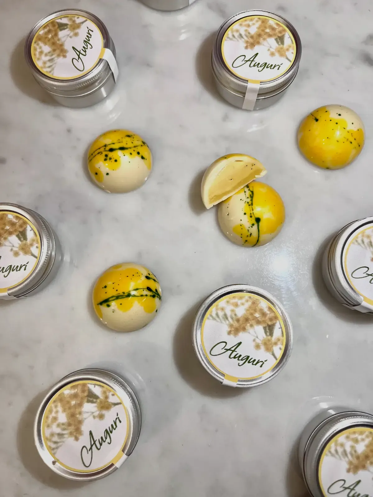 Mimose collection — Radiosa praline and Sole di Marzo bar, hand-decorated white chocolate with mimosa-inspired decoration