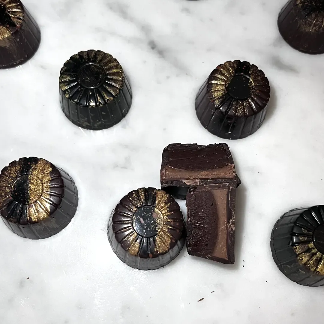 Corretto dark chocolate praline with hand-decorated shell