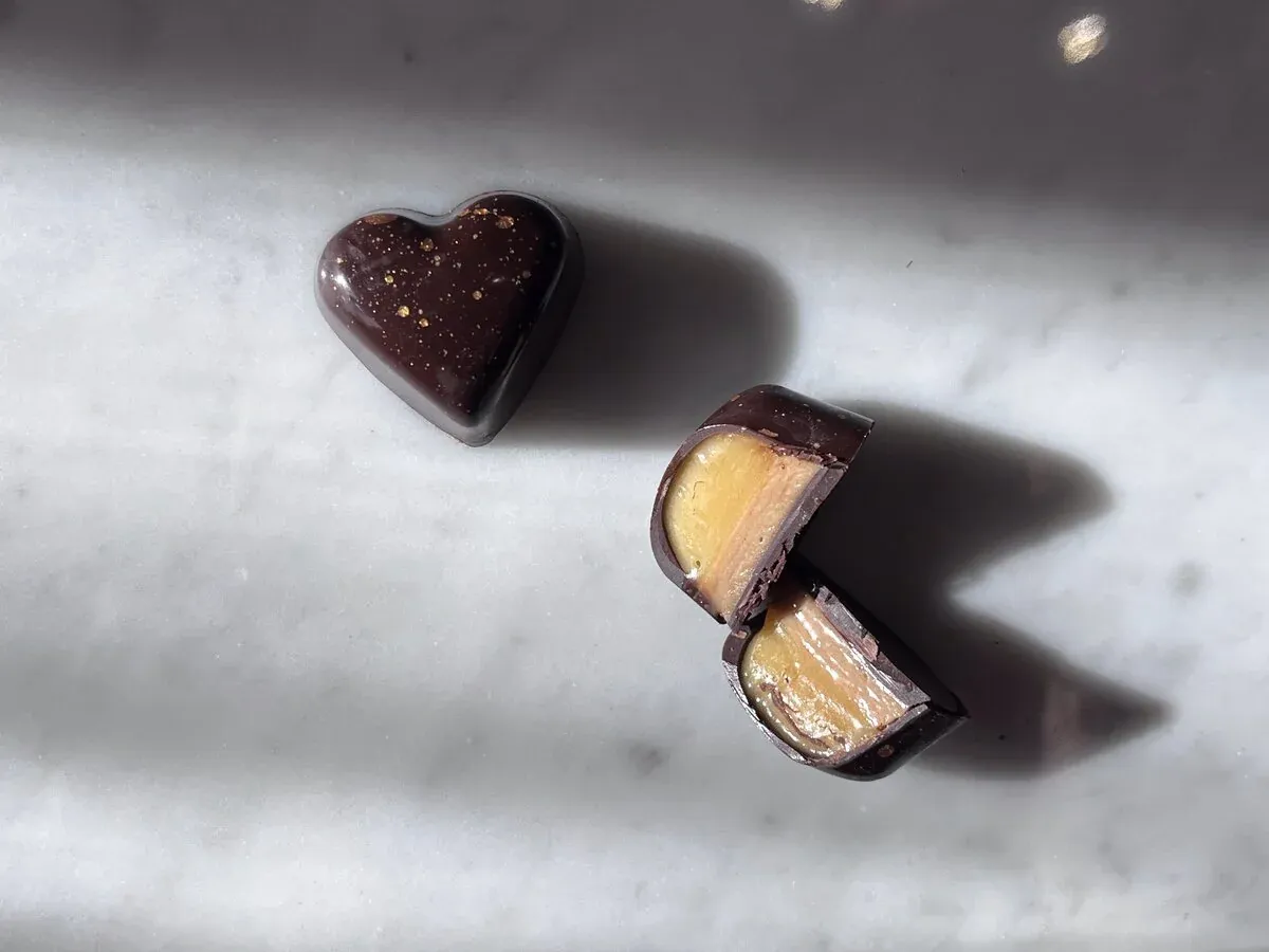 Te chocolate showing layers of citrus caramel and hazelnut gianduja